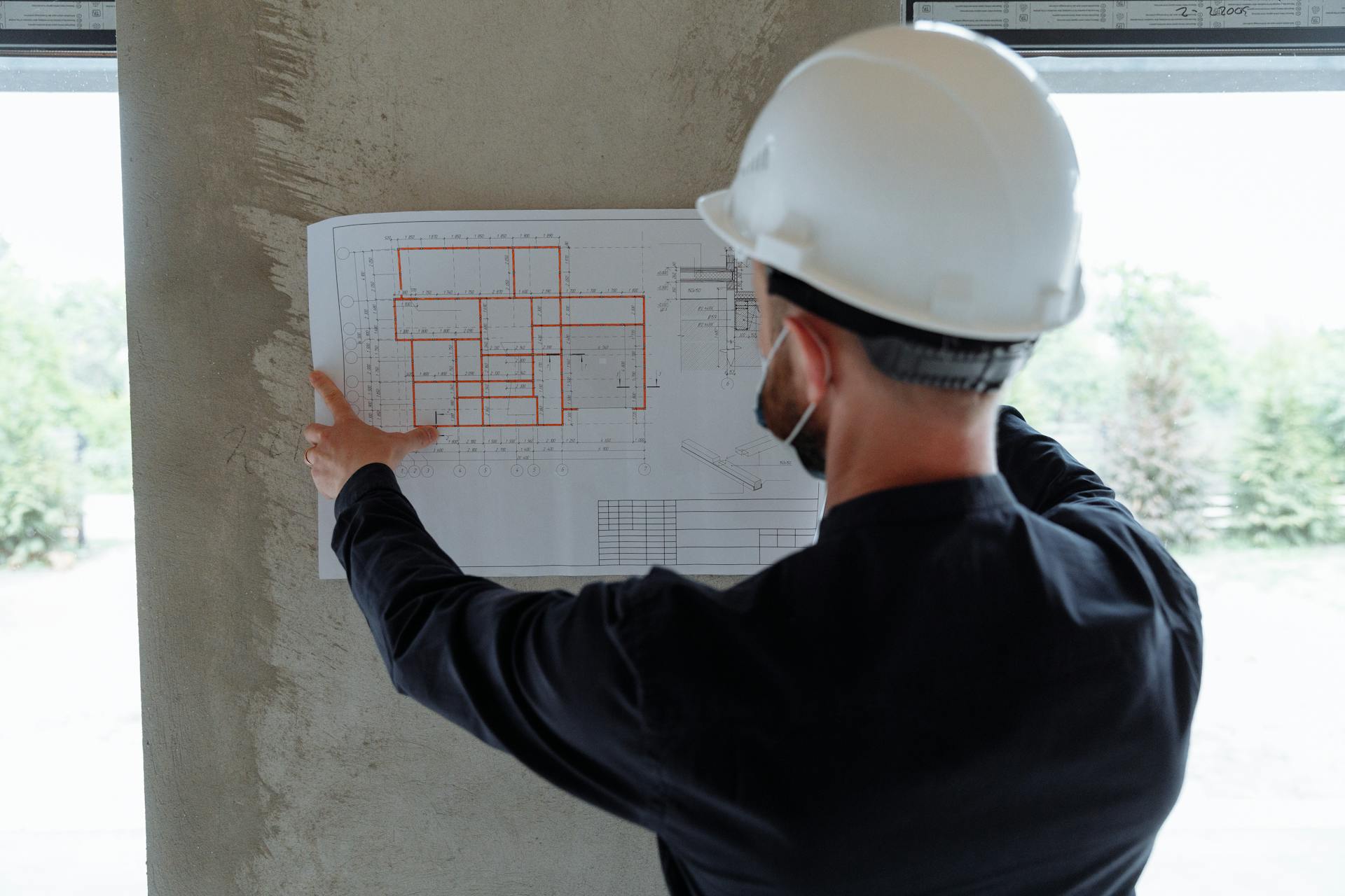 Construction project manager supervising field operations at HD Global Group job site